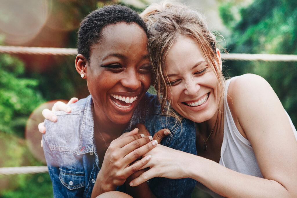 Image of two friend laughing together