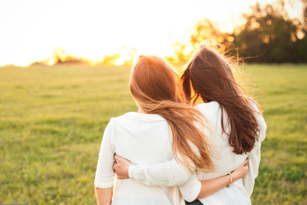 Two friends hugging