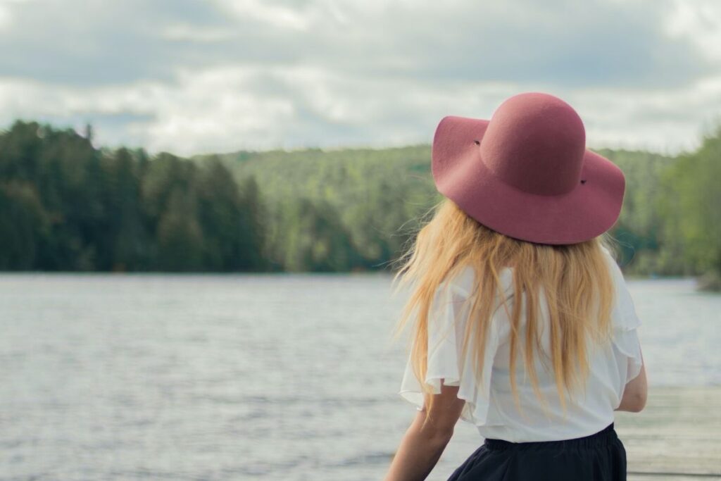 Young woman looking out to sea