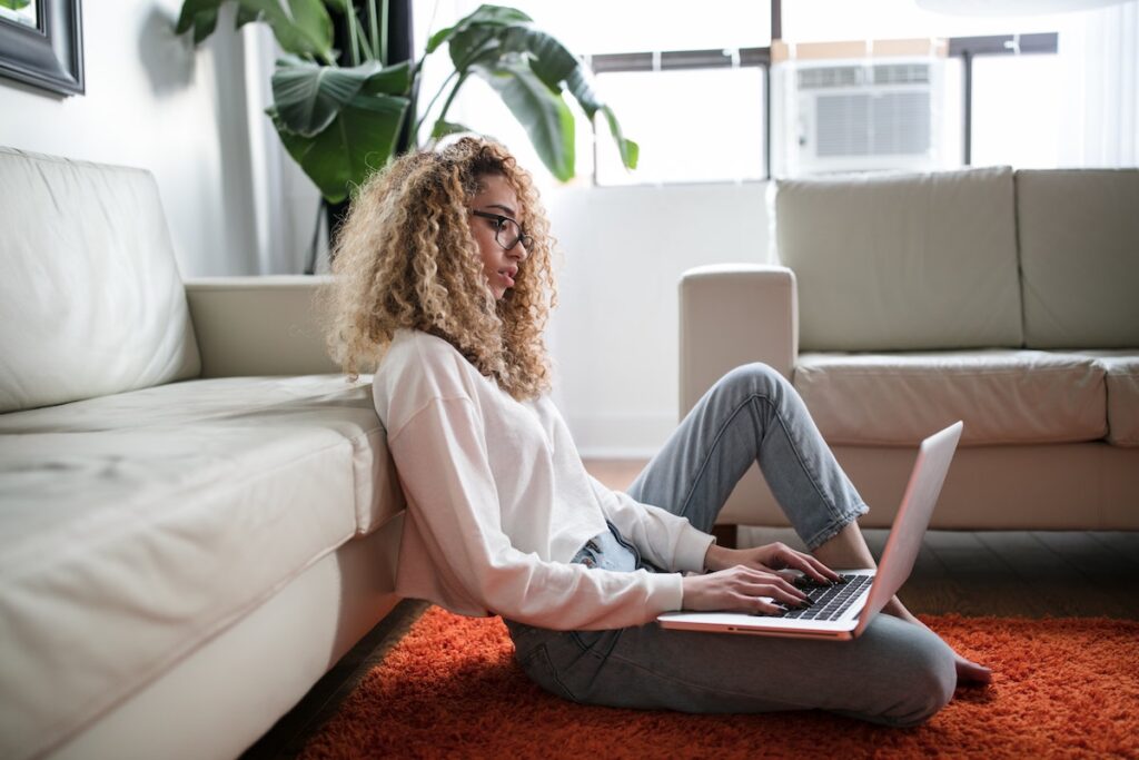 Young woman working on laptop from home