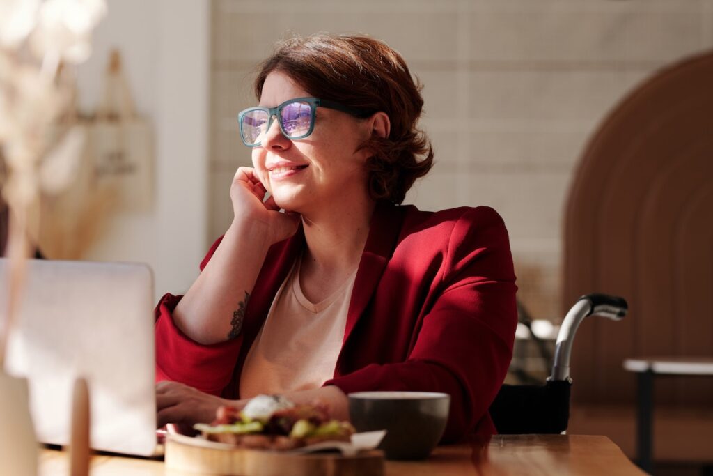 Woman smiling at laptop