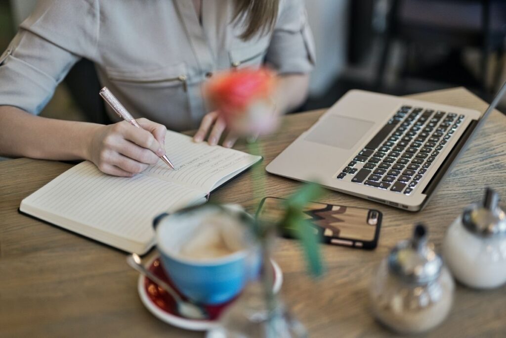 Woman writing in journal