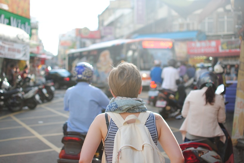 Woman walking in busy street