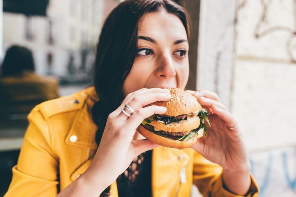 Woman eating burger