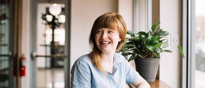 Young woman in a cafe smiling