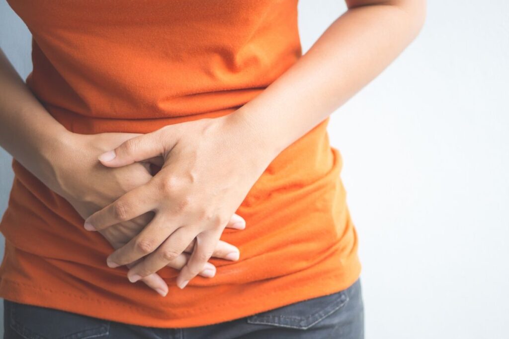 Woman holding stomach