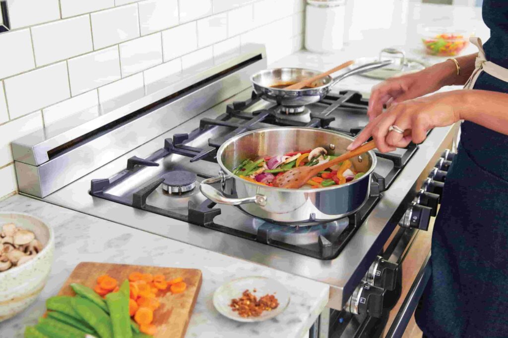 Close-up of a woman cooking a healthy meal