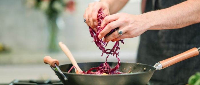 Person cooking in a kitchen