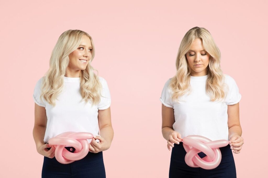 Lisa and Alana holding balloon-shaped intestines