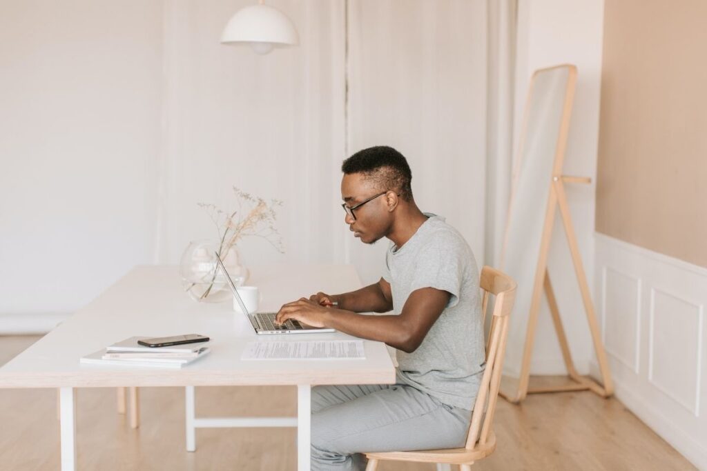 Man using laptop at table