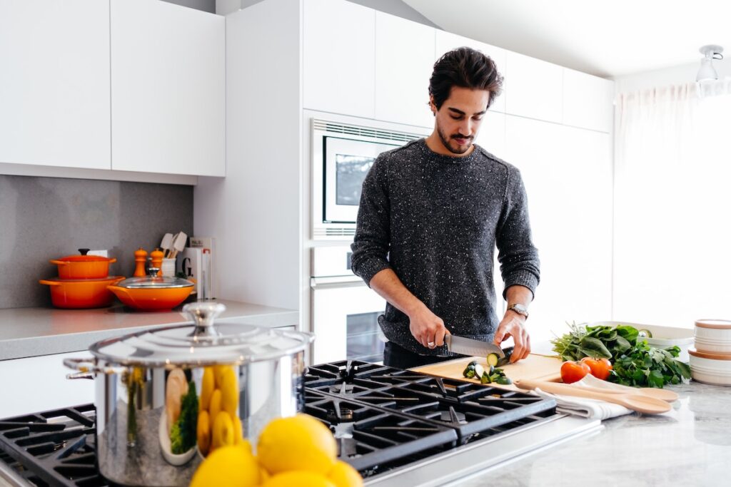 Man in kitchen cooking