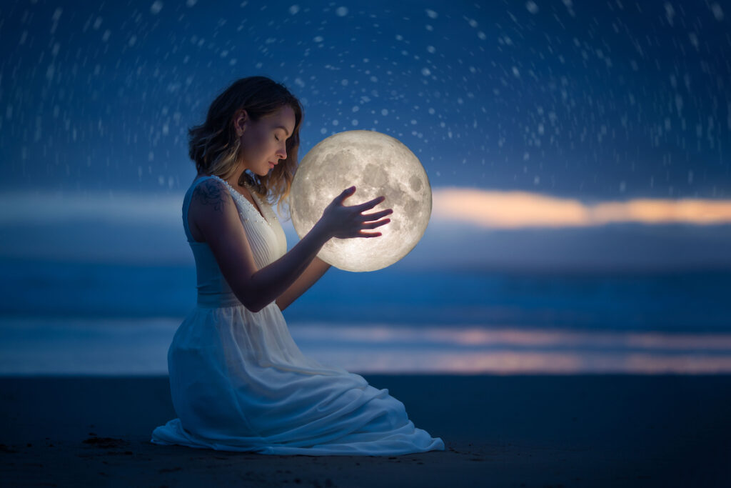 Woman holding the moon