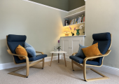 A comfortable therapy room with two chairs