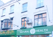 This image is a photo I took of Kingston Natural Health Centre near to red phone boxes