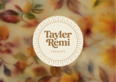 &ldquo;Tayler Remi Therapy&rdquo; logo on a warm, blurred floral background.