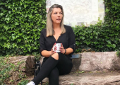 Female counsellor relaxing with a cup of coffee in the garden.