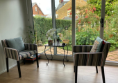 A comfy sofa is also available looking out over the gardenhe garden..