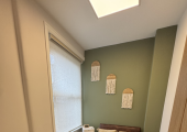 Wednesdays Golders Green Room - cozy with warm tones, soft lighting, comfy chairs and calming art