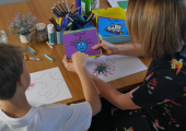 A young boy in art therapy, understanding and identifying big feelings.