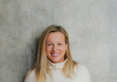 Victoria Simpson of Victoria Simpson Counselling standing against a wall and looking into the camera