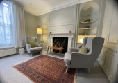 Quiet psychotherapy consulting room with chairs and natural light