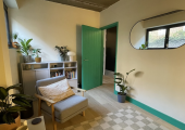 bright therapy room, therapist chair and door