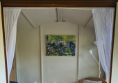 I work from my cosy summerhouse room in a large and tranquil garden.