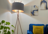 Aude Therapy practice room with blue sofa, plant and window