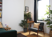 Natural light and calming plants bring a sense of tranquility to my therapy room.
