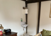 The Courtyard Centre for Yoga-This is the room with 2 chairs, a table and access to drinking water too.