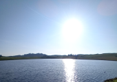 Being in nature to pause and see the sunshine reflecting on the water, giving a sense of calm.
