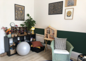 Resource area with small objects, exercise ball, fold-out floor mat and cushions