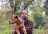 This is an image of Jason with an Irish Terrier called Luna.