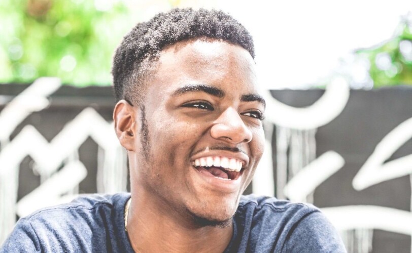 Image of a young man laughing