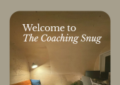 Adam Print Coaching Snug garden cabin with purpose-built desk, orange sofa, natural wood walls and warm lighting.
