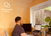 Adam Print working at his desk in the cosy Coaching Snug.