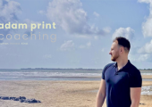 Adam Print Coaching logo with Adam Print looking out to sea, reflecting on the beach.