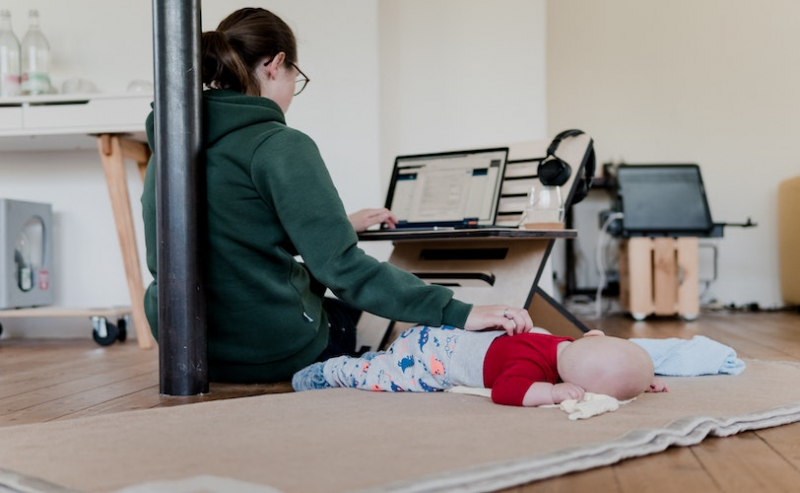 Mum working with laptop and baby
