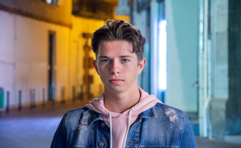 Young man staring into camera