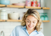 Nutritionist chopping a pomegranate in a kitchen