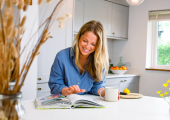 Woman looking at recipe book