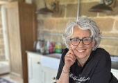 Nutritionist Lisa Picken in the kitchen chopping vegetables