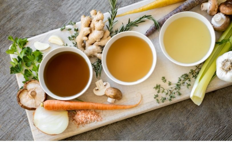 A selection of soups on a chopping board
