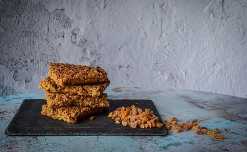 Flapjacks on dark chopping board