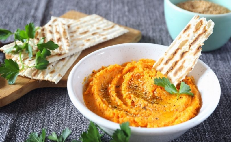 Dip in bowl with flatbreads on side